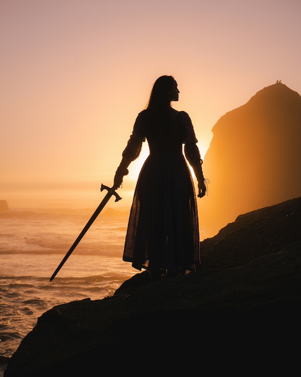 Woman with a sword symbolizing battling for breakthrough with the Word, worship, and prayer. 